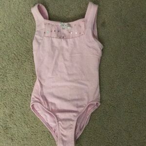 Pink tank leotard.